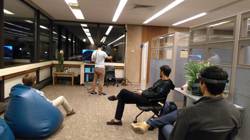 Student using the VIVE while three others watch